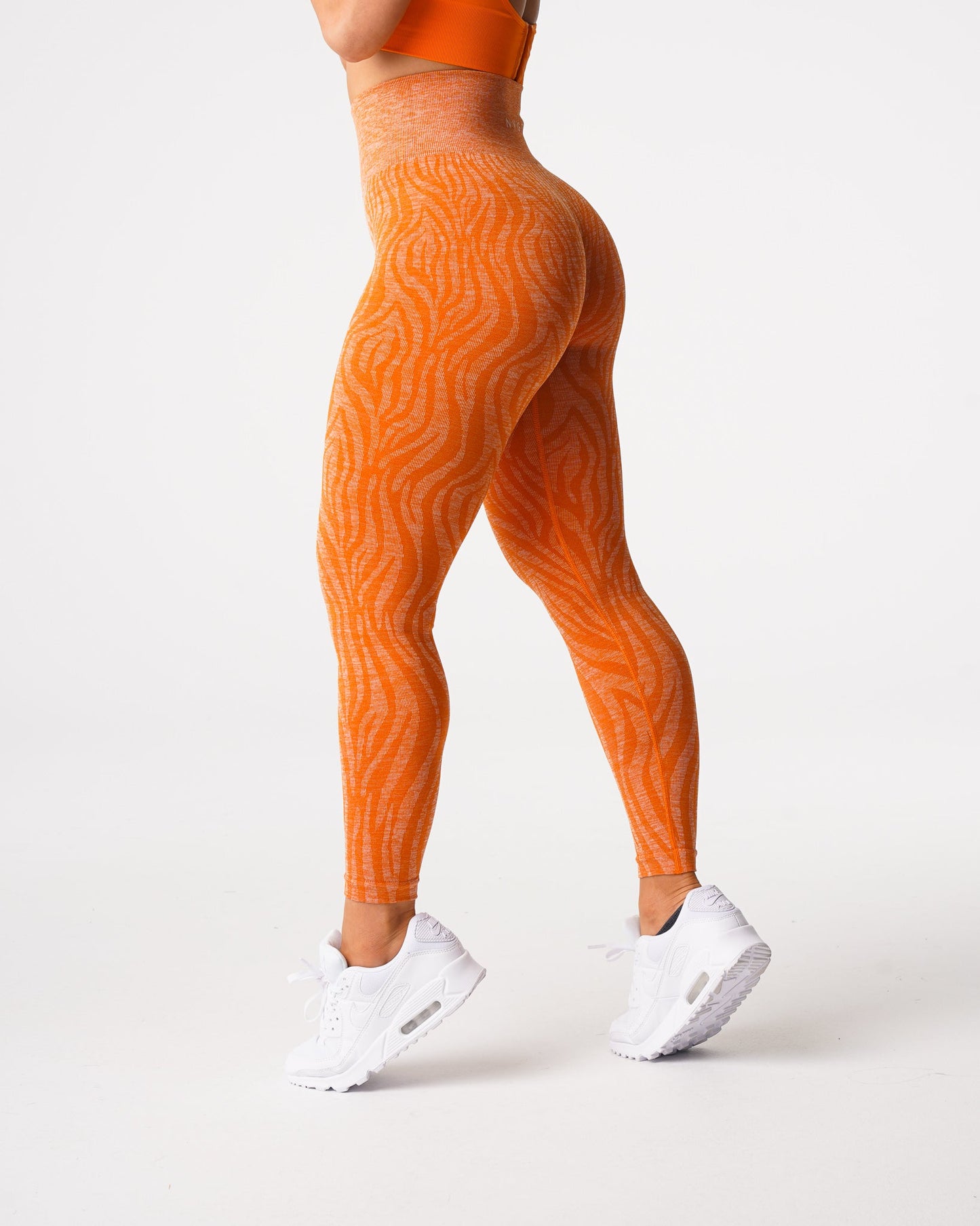 Women Burnt Orange Zebra Seamless Leggings - NVGTN