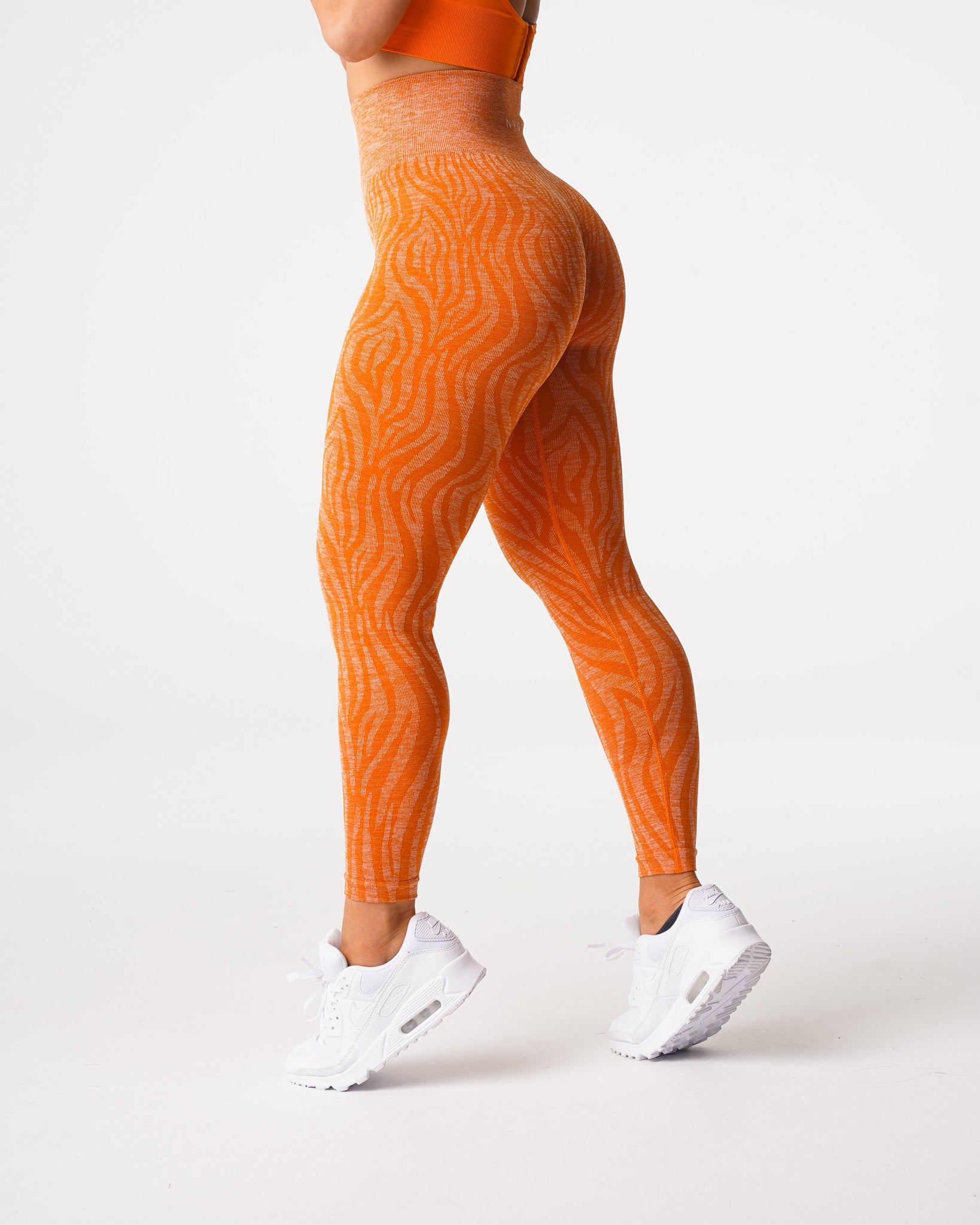 Women Burnt Orange Zebra Seamless Leggings - NVGTN