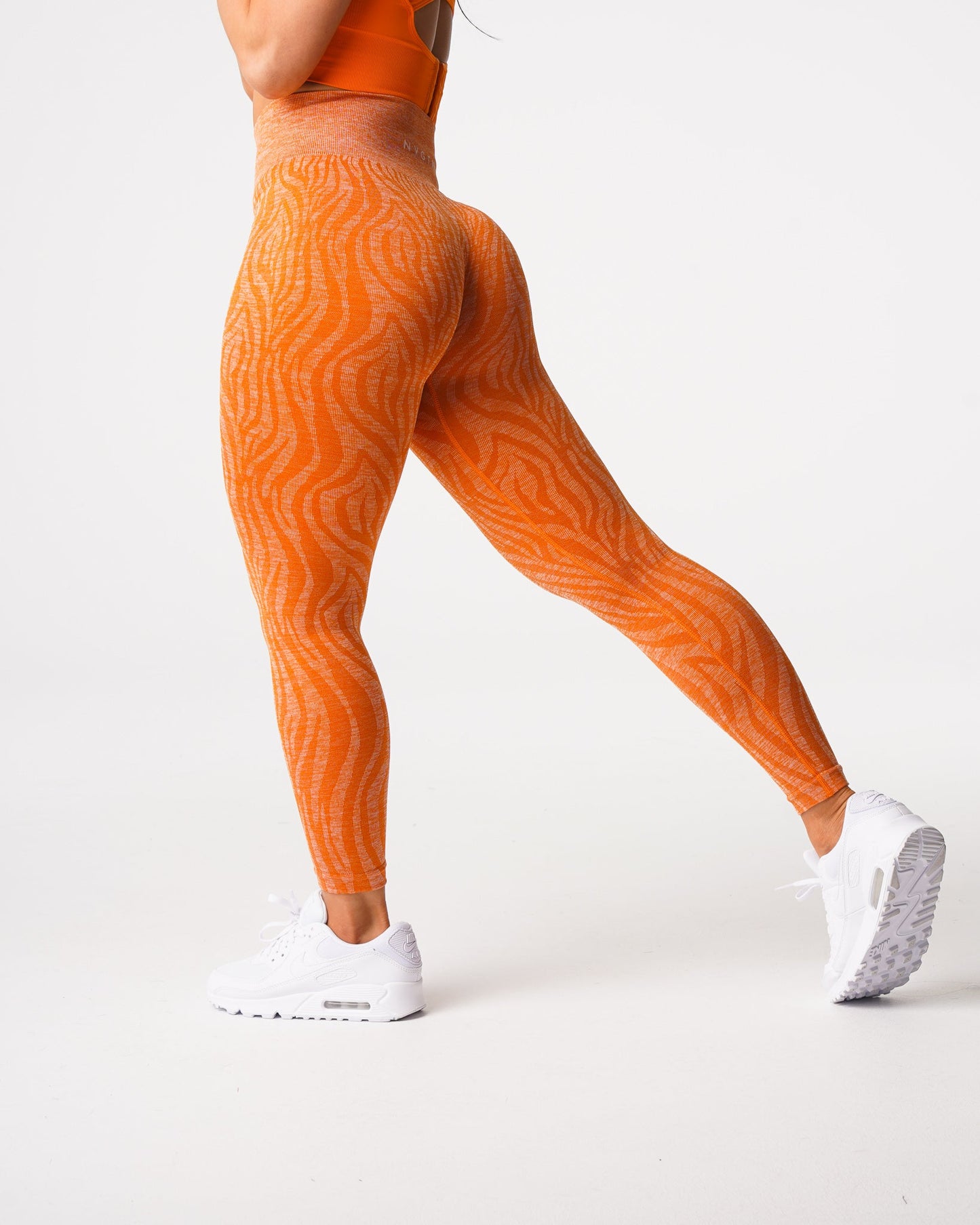 Women Burnt Orange Zebra Seamless Leggings - NVGTN