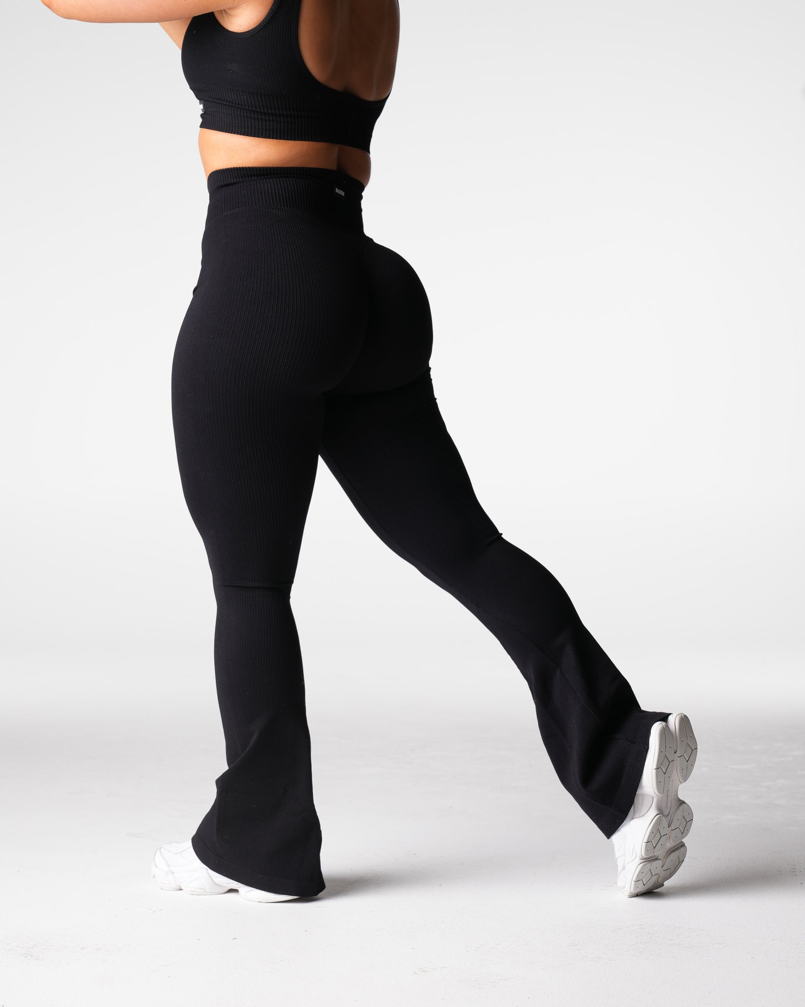 Women Black Harmony Ribbed Seamless Flare Leggings - NVGTN