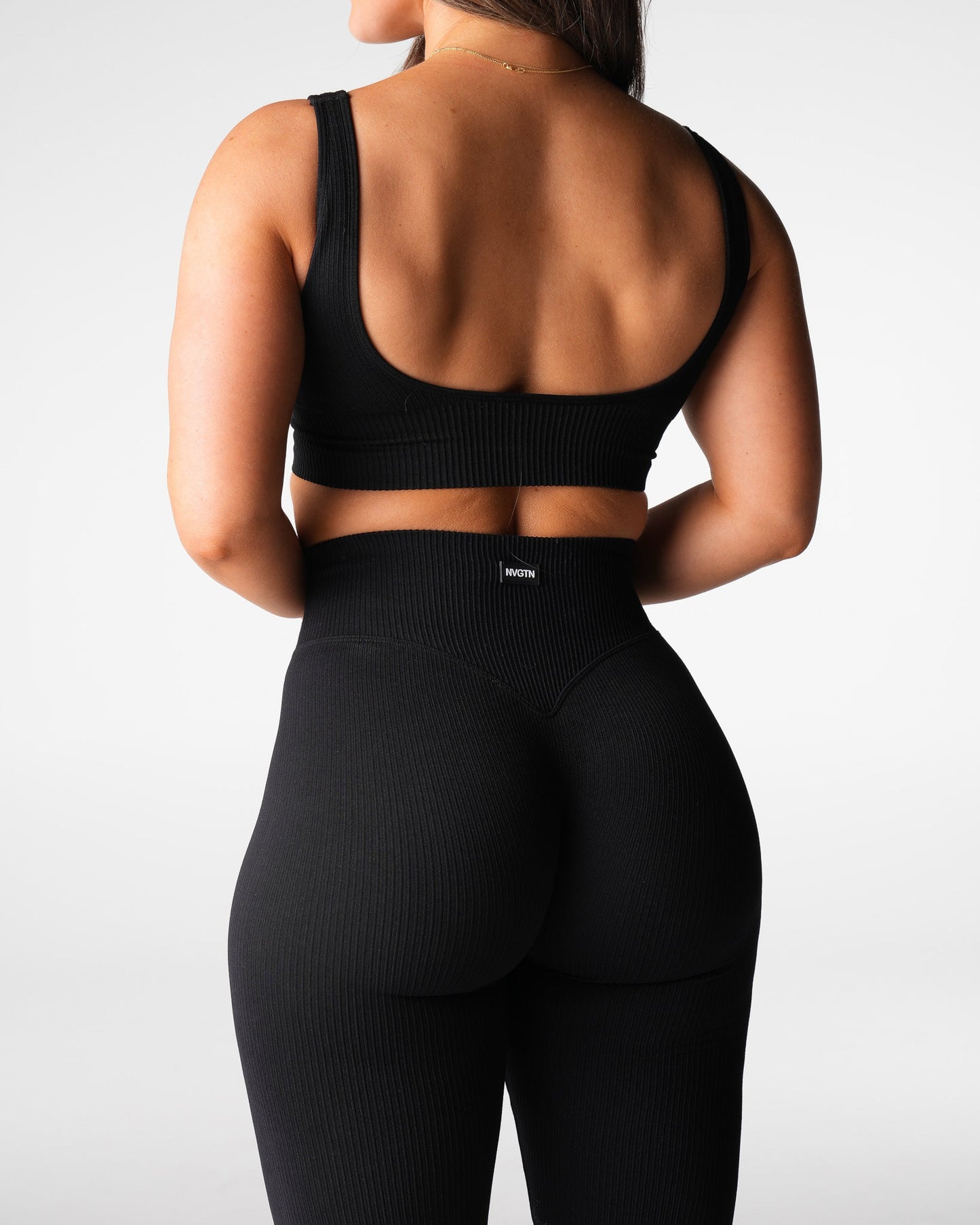 Women Black Harmony Ribbed Seamless Flare Leggings - NVGTN