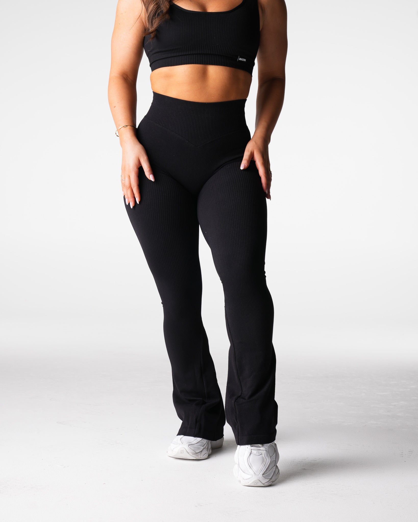 Women Black Harmony Ribbed Seamless Flare Leggings - NVGTN